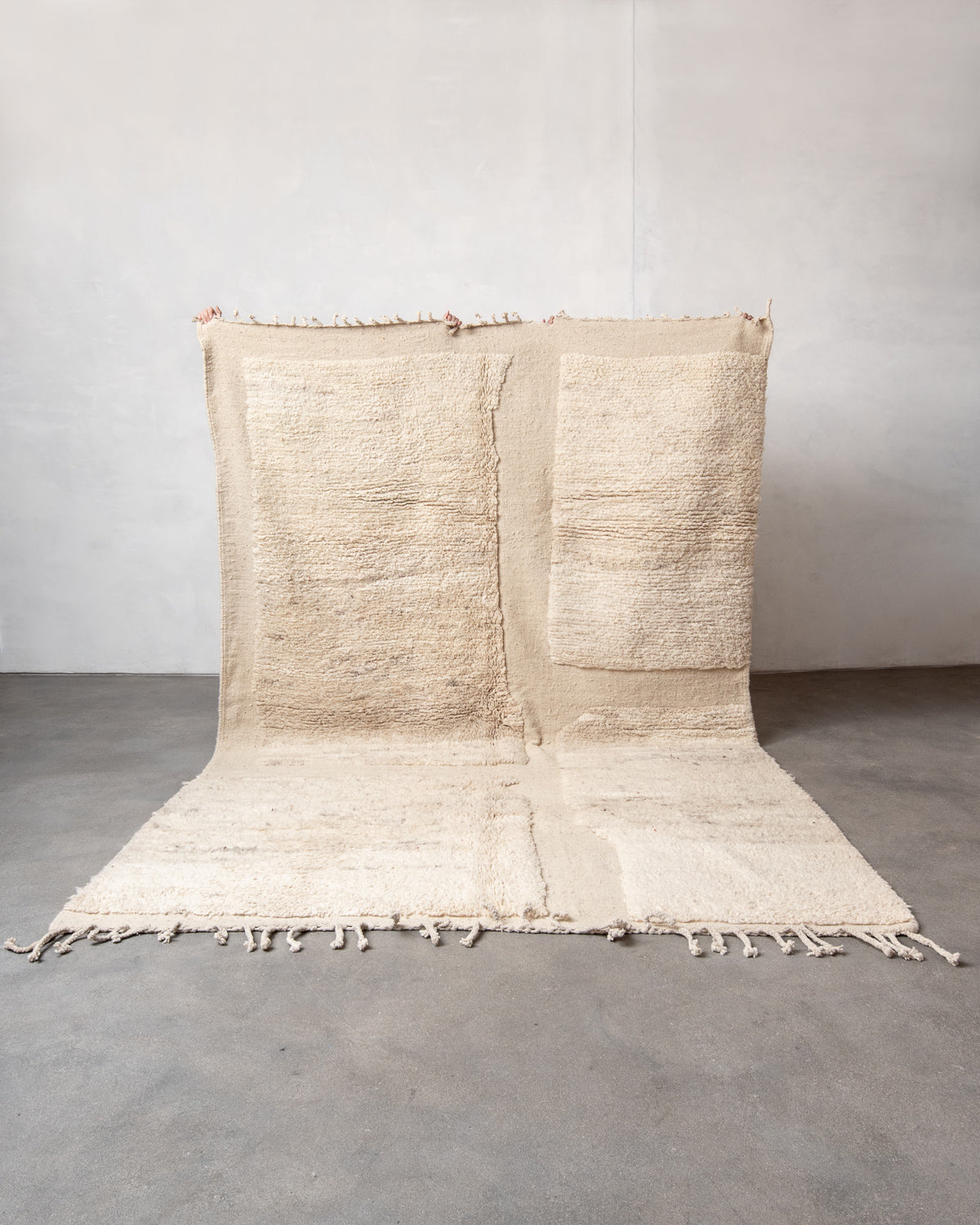 Modern, designer, handcrafted Berber rug from Morocco. Beniourain carpet with minimalist design, natural wool pile and a fluffy texture.